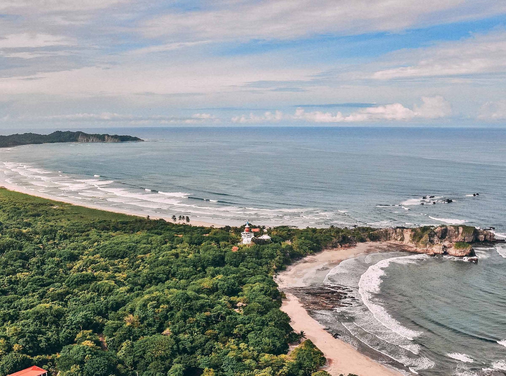 Aerial view of the coast and tropical forest from the Aguas Pacíficas brochure